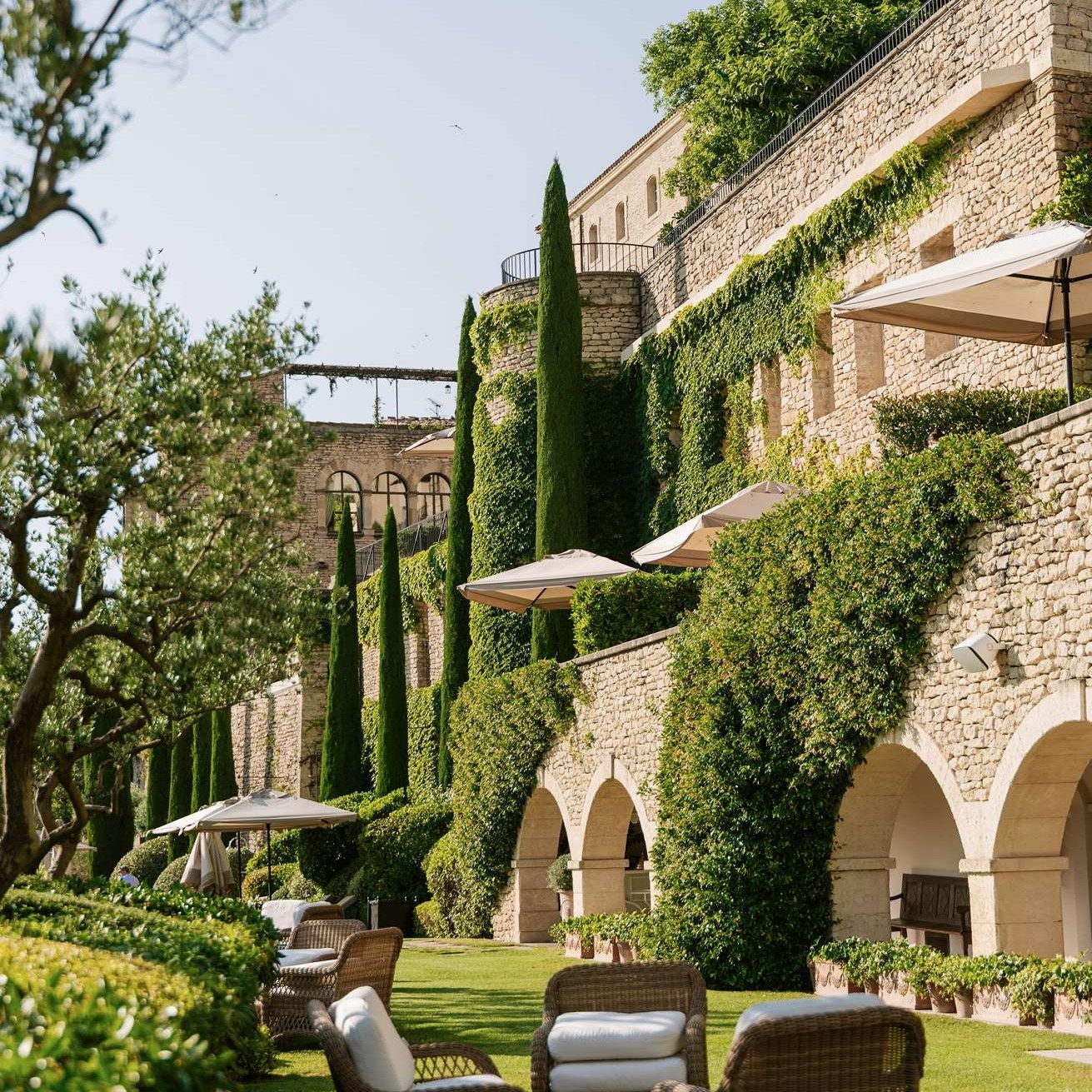 The ivy-clad ramparts of La Bastide de Gordes and the terraced gardens