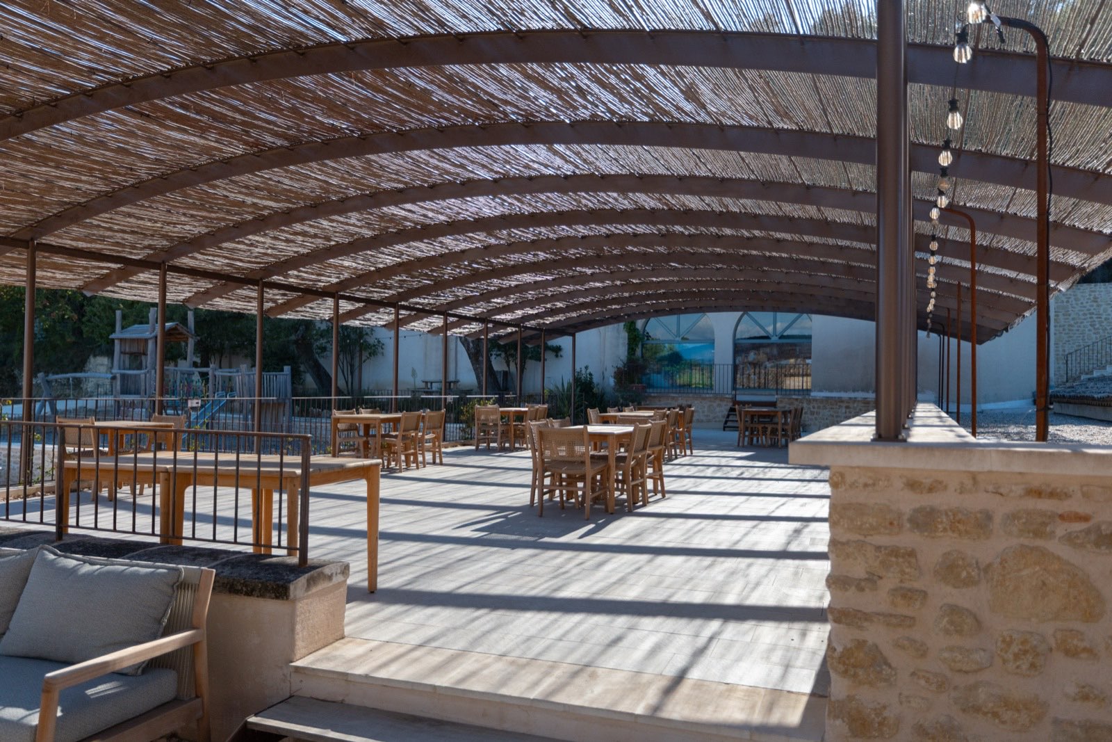 Dining terrace under the reed canopy