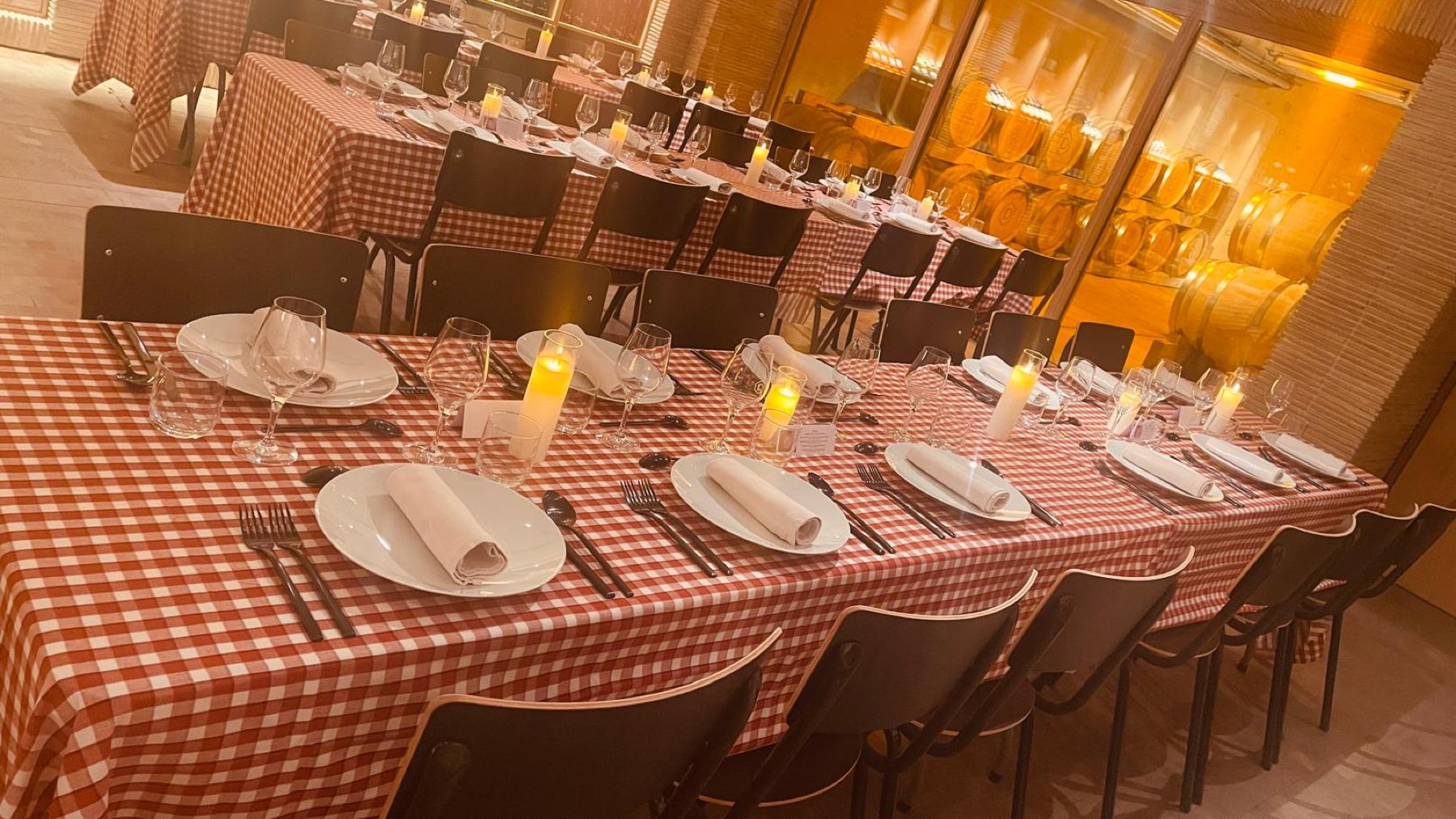 Dinner tables dressed in red gingham at Domaine Les Davids