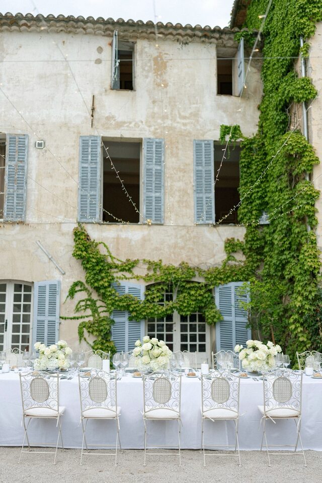 A long table laid along the facade of a Provencal bastide