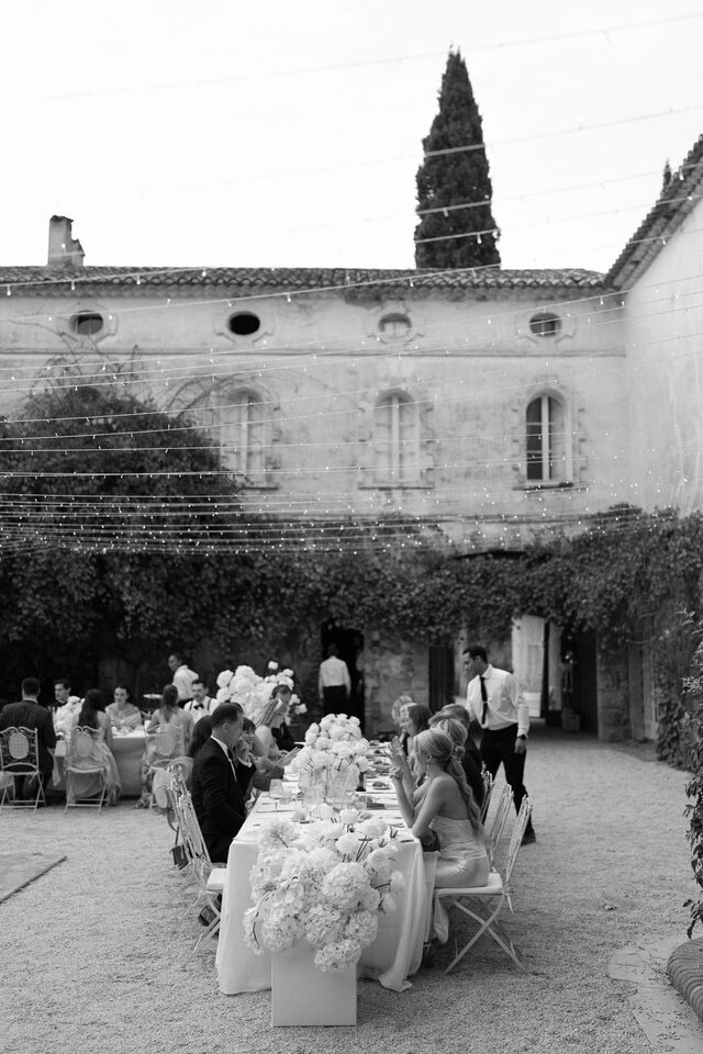 Dinner served in the courtyard of a mas, under the cypresses