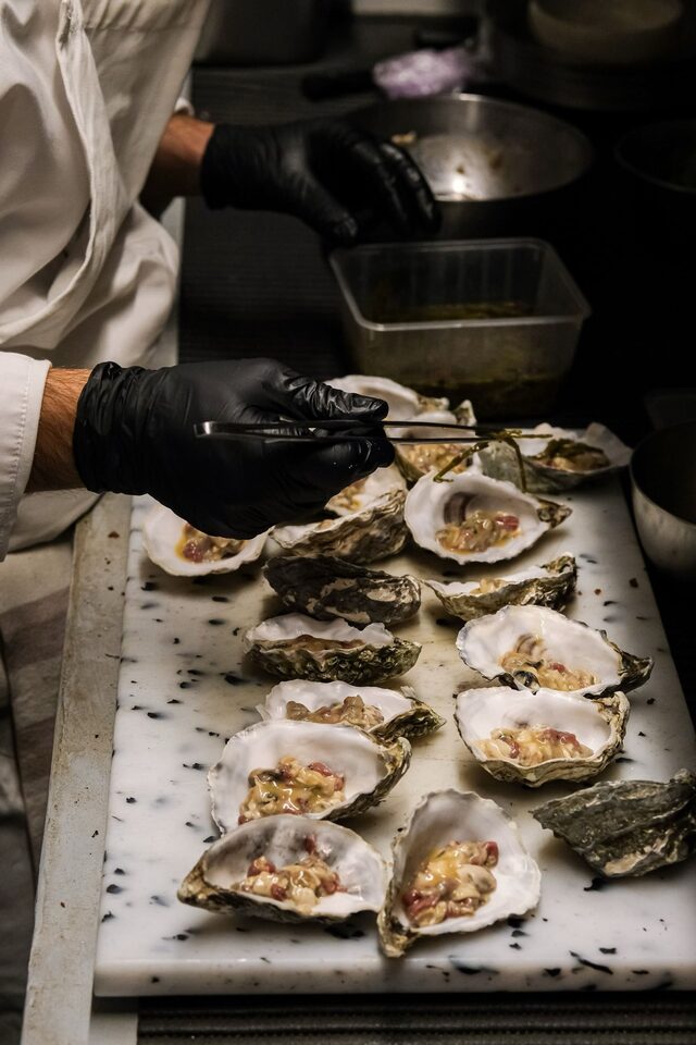 Oysters dressed to order at the service pass