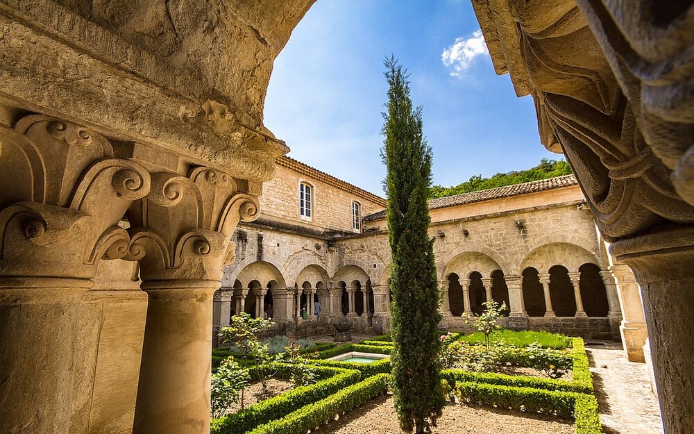 The Romanesque cloister of the Abbaye de Senanque, its arcades opening onto the garden